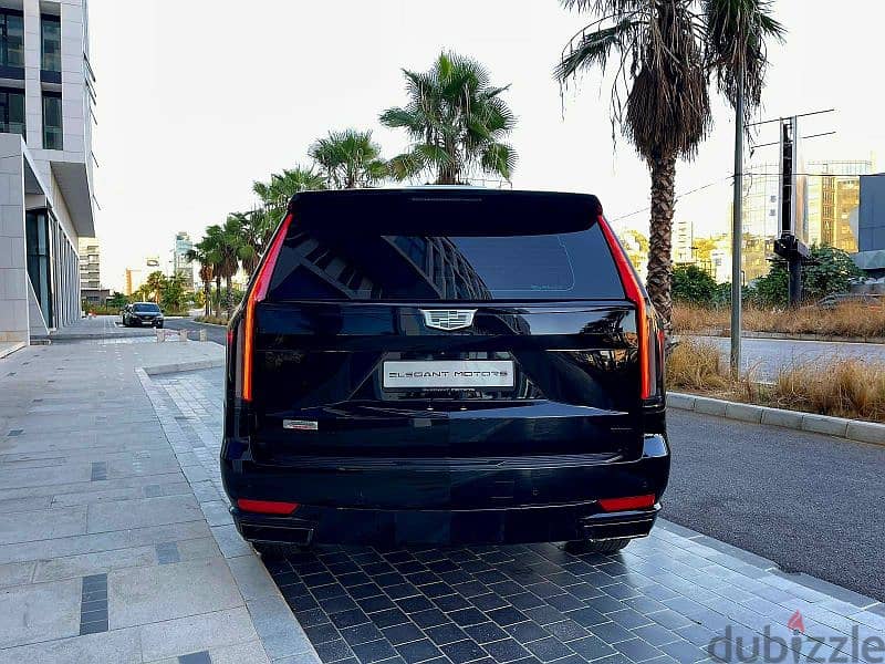 2022 Escalade 600 Sport in sleek black with a luxurious brown interior 4