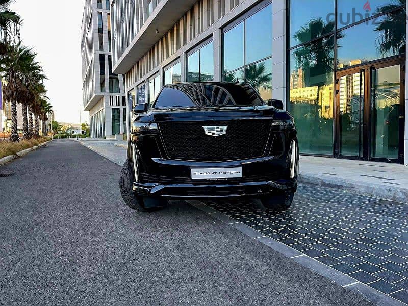 2022 Escalade 600 Sport in sleek black with a luxurious brown interior 6