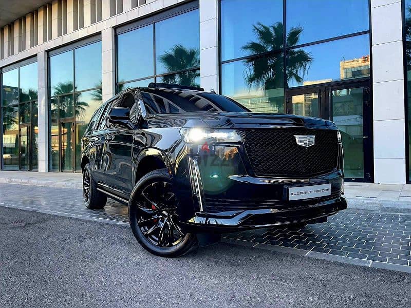 2022 Escalade 600 Sport in sleek black with a luxurious brown interior 7