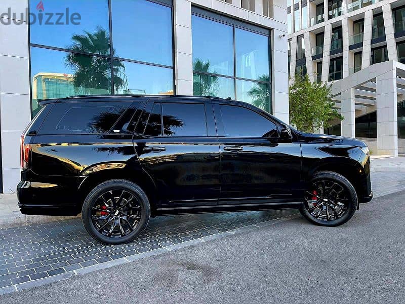 2022 Escalade 600 Sport in sleek black with a luxurious brown interior 8