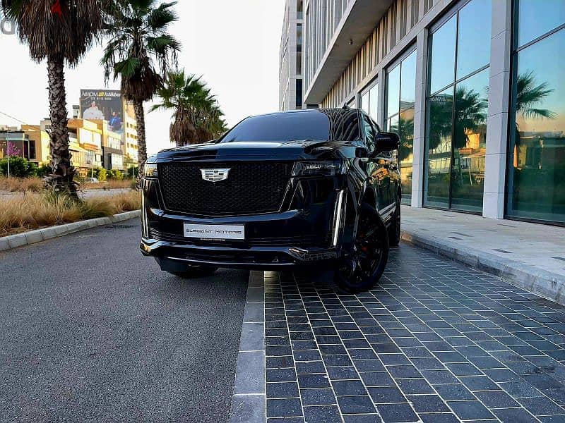 2022 Escalade 600 Sport in sleek black with a luxurious brown interior 9