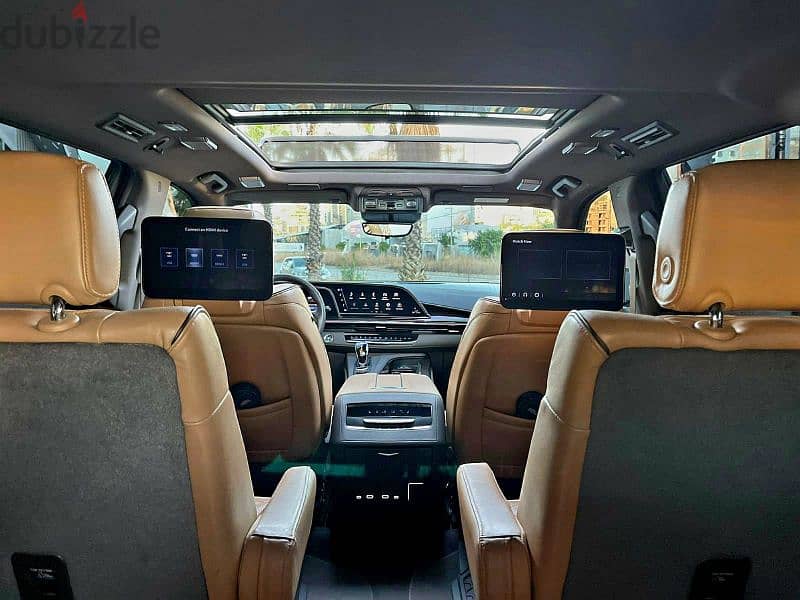 2022 Escalade 600 Sport in sleek black with a luxurious brown interior 10