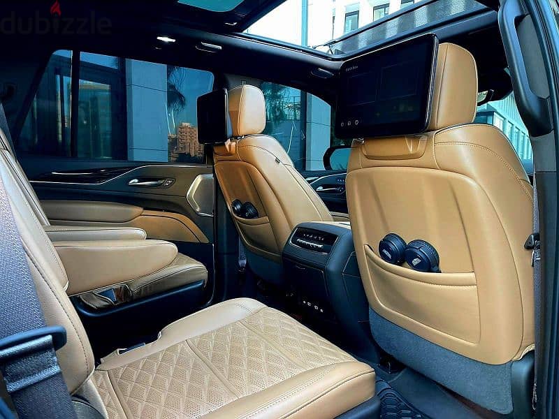 2022 Escalade 600 Sport in sleek black with a luxurious brown interior 11