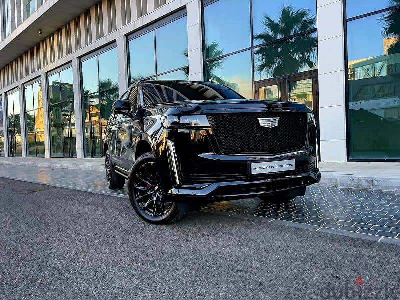 2022 Escalade 600 Sport in sleek black with a luxurious brown interior 12