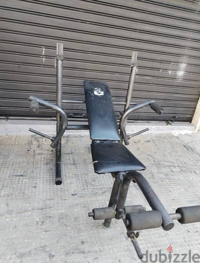 Adjustable bench with Rack used like new 68$