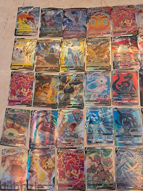 Shiny vmax and shiny normal Pokémon cards. 0