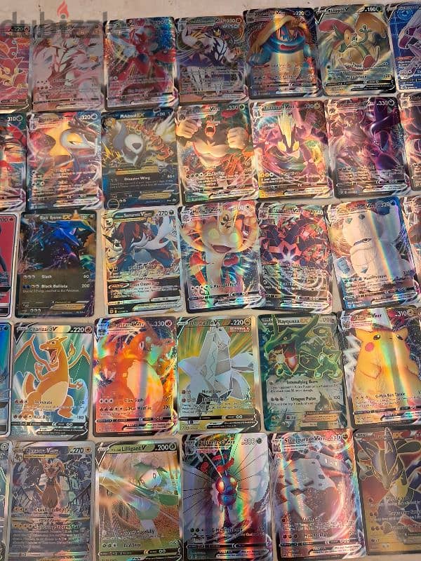 Shiny vmax and shiny normal Pokémon cards. 1