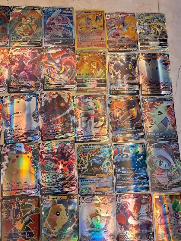 Shiny vmax and shiny normal Pokémon cards. 2