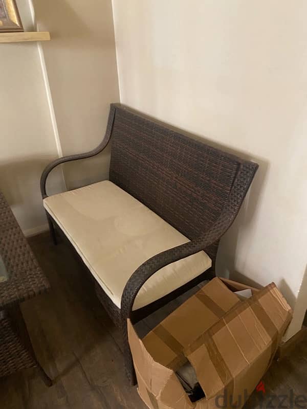 Rectangular brown resine table with 2 chairs and one double armchair. 0