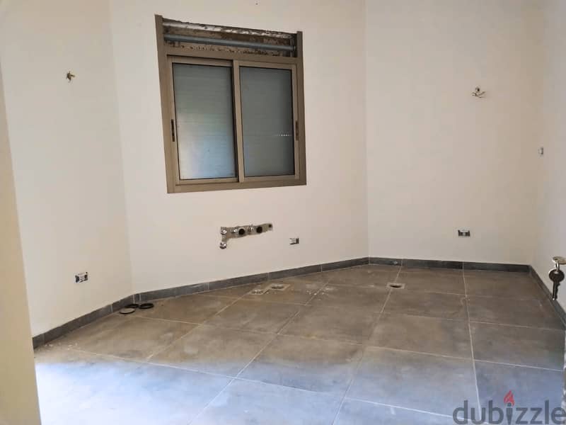 L16384-Apartment With a Garden For Sale in Ballouneh 2