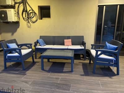 Outdoor seats with table and umbrella