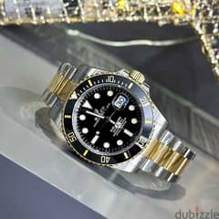 Gold and black Rolex 0