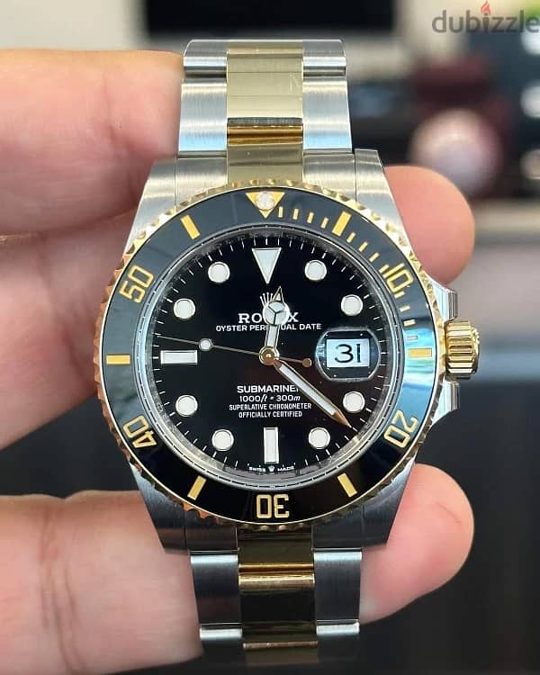 Gold and black Rolex 1