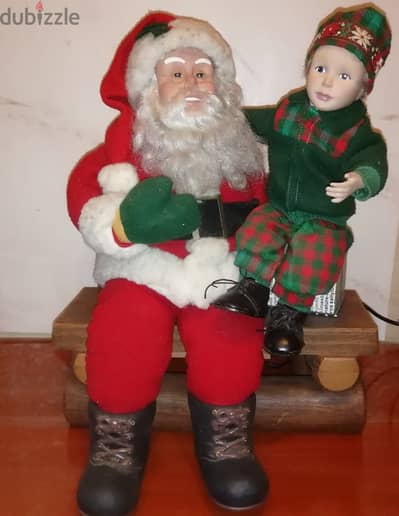 Holidays creation Christmas decoration Animated santa With kid sitting