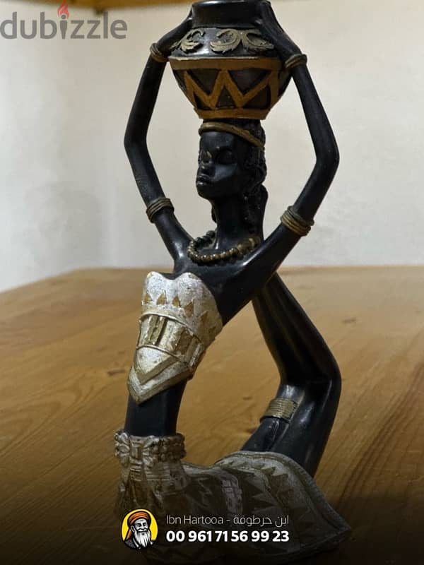 African figurine of a woman with a water bucket 3