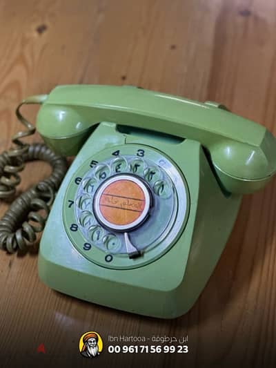 Old rotary dial phone, Arabic-English dual language