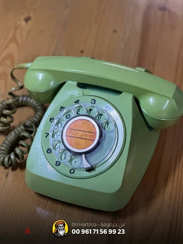 Old rotary dial phone, Arabic-English dual language 0