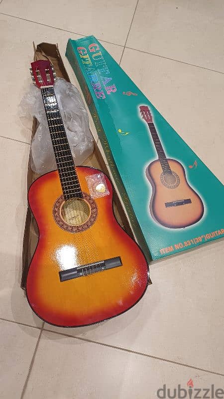 guitar 3/4  new in box 0