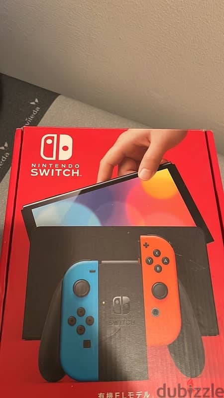 barely used Nintendo switch oled with carrying  case and Maro kart 0