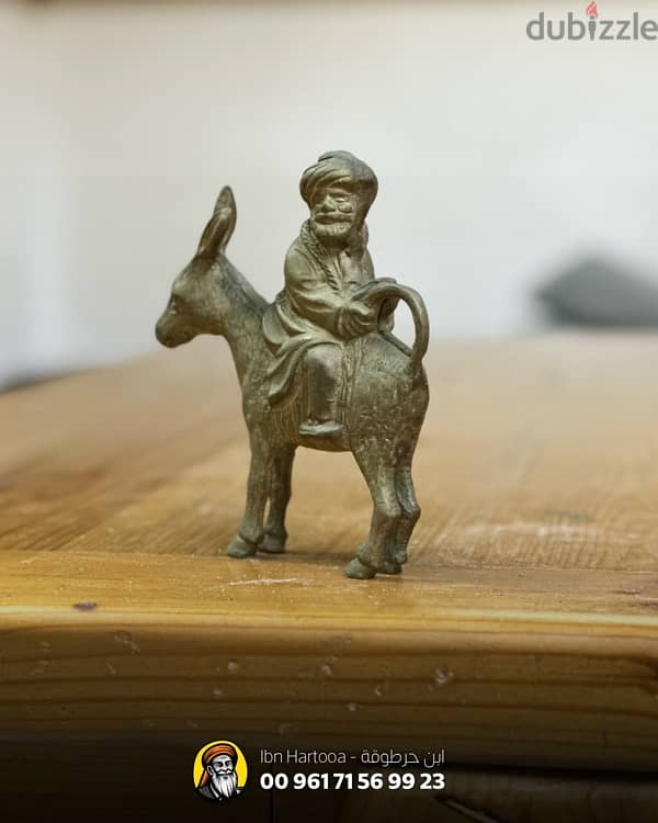 ‏A weighted copper statue of Juha and his donkey. 1