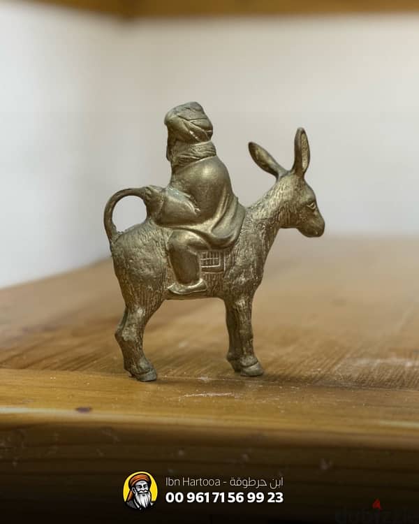 ‏A weighted copper statue of Juha and his donkey. 2