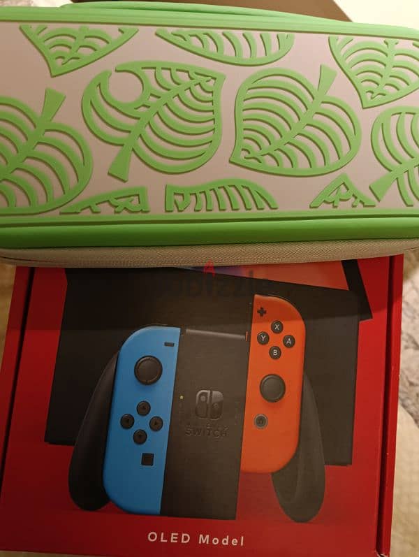 Nintendo switch OLED new in box with 1 game and case 0