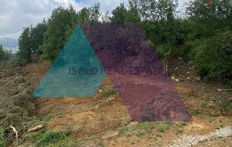 A 2286 m2 land having an open mountain view for sale in Kfarzebian 0