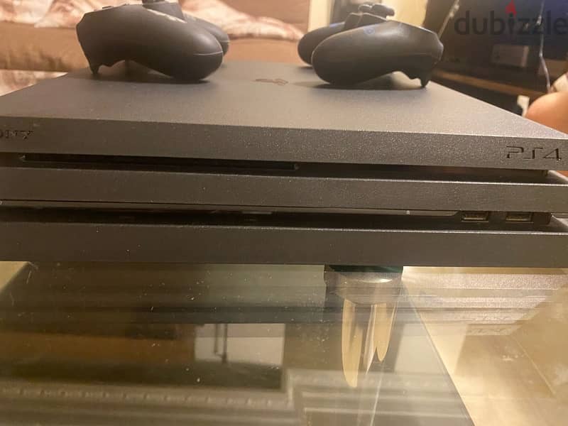 PS4 Pro barely used with 2 games and 2 controllers 2