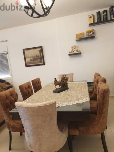 Table with 8 chair and side board