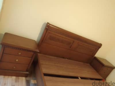 large bed with two small commodes