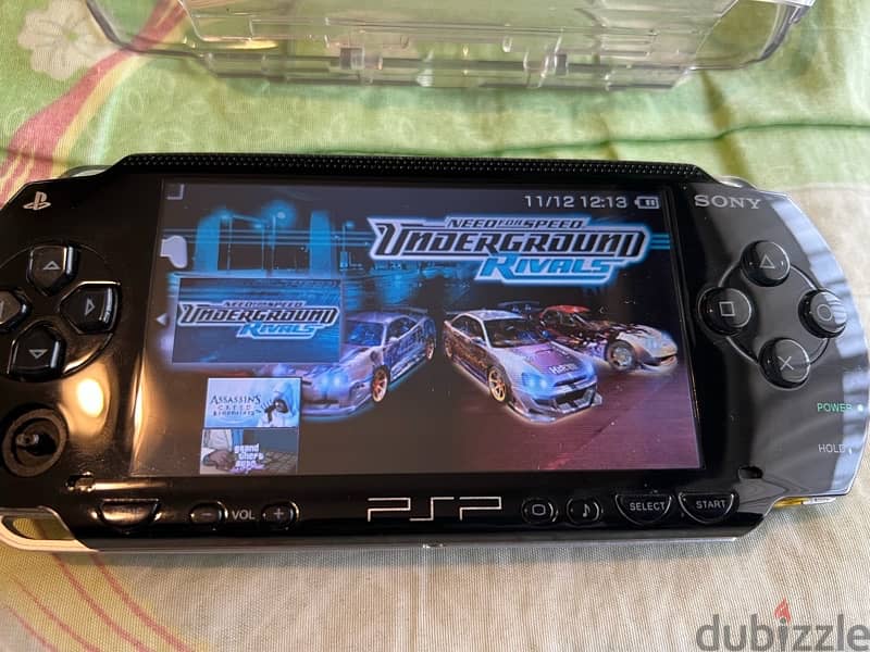 PSP  + COVER + CHARGER + GAMES 7