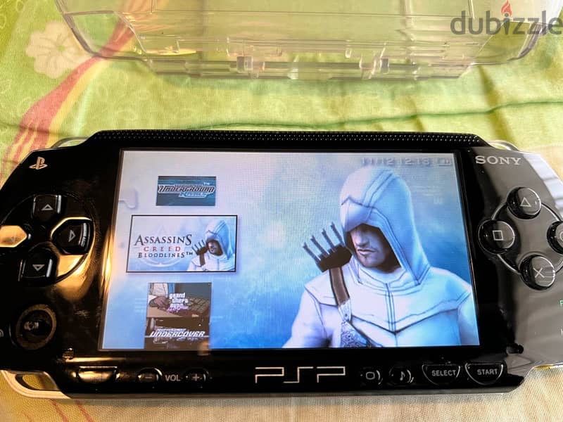 PSP  + COVER + CHARGER + GAMES 8