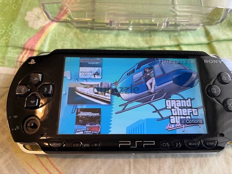 PSP  + COVER + CHARGER + GAMES 9