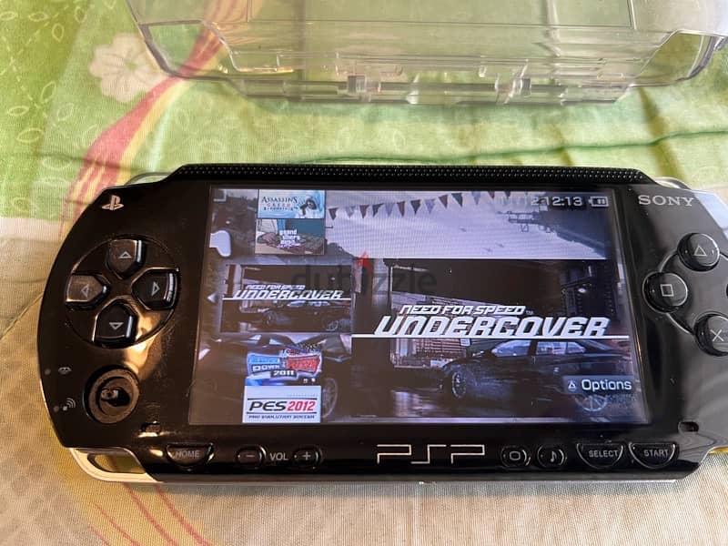 PSP  + COVER + CHARGER + GAMES 10