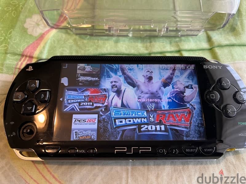 PSP  + COVER + CHARGER + GAMES 11