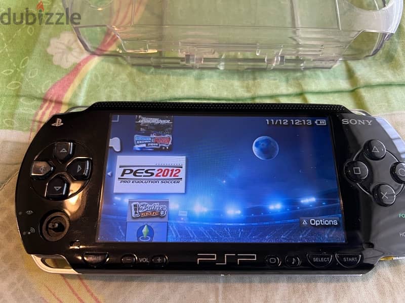 PSP  + COVER + CHARGER + GAMES 12