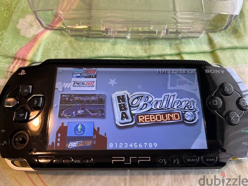 PSP  + COVER + CHARGER + GAMES 13