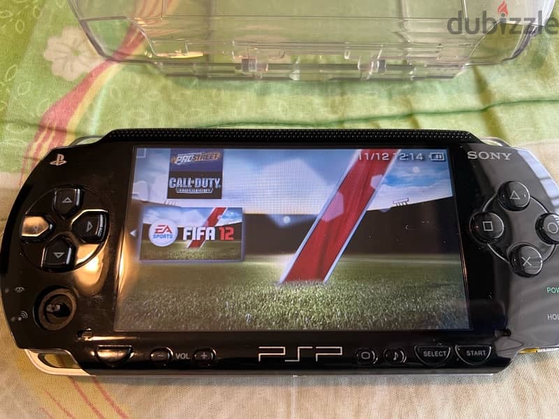 PSP  + COVER + CHARGER + GAMES 14