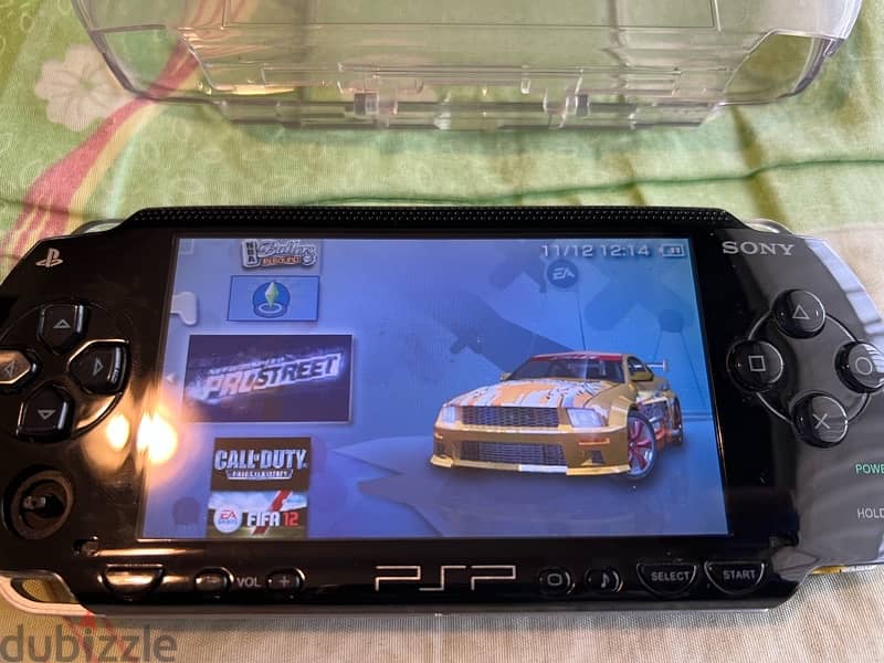 PSP  + COVER + CHARGER + GAMES 15