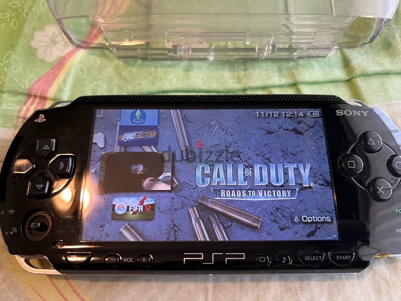 PSP  + COVER + CHARGER + GAMES 16