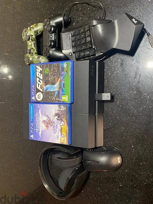 ps4(used like new)with sony headset,keyboard mouse,2 controllers, 2cds 0