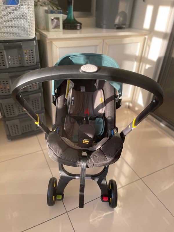 Doona+ Baby Car Seat & Travel Stroller with isofix car base 9