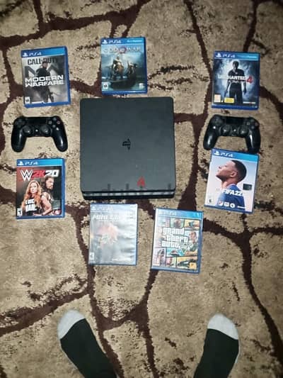 ps4 slim 500 gb 2 controlers and 7 cds