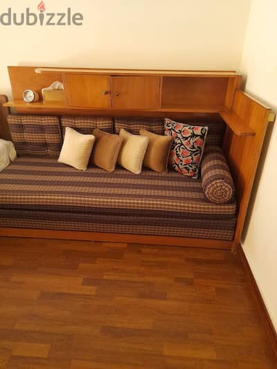 Sofa with wall unit