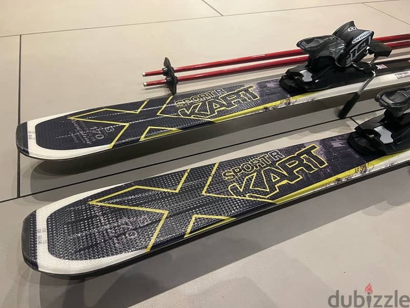 Salomon Ski and poles used 2 times 4