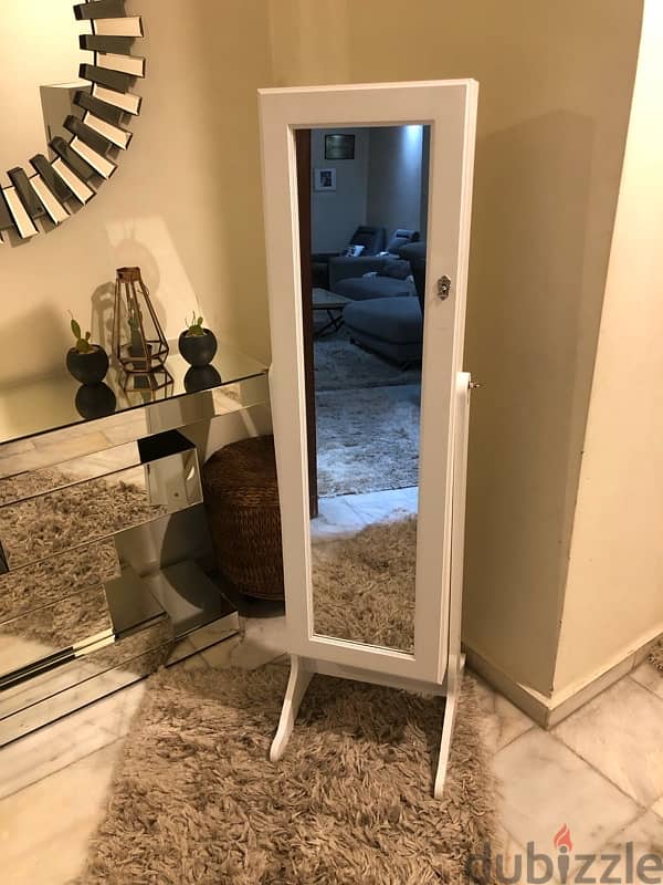 mirror jewelry cabinet like new . 120$ 2