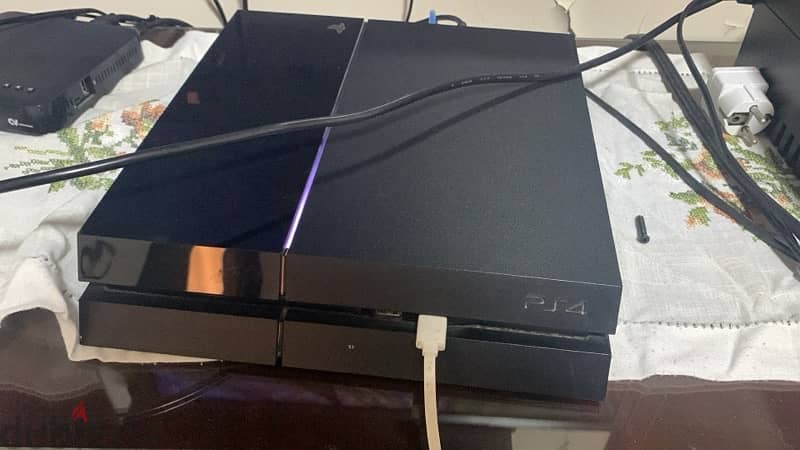 used ps4 with controllers and games 0