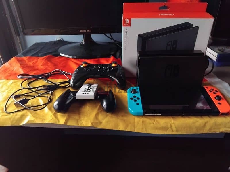 Nintendo switch used+charging grip+extra controller+charger+fc25 180$ 0