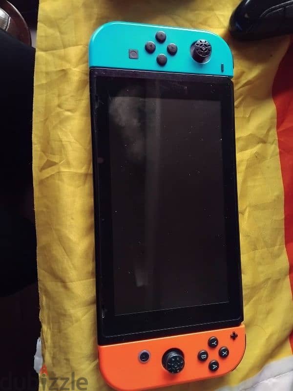 Nintendo switch used+charging grip+extra controller+charger+fc25 180$ 1