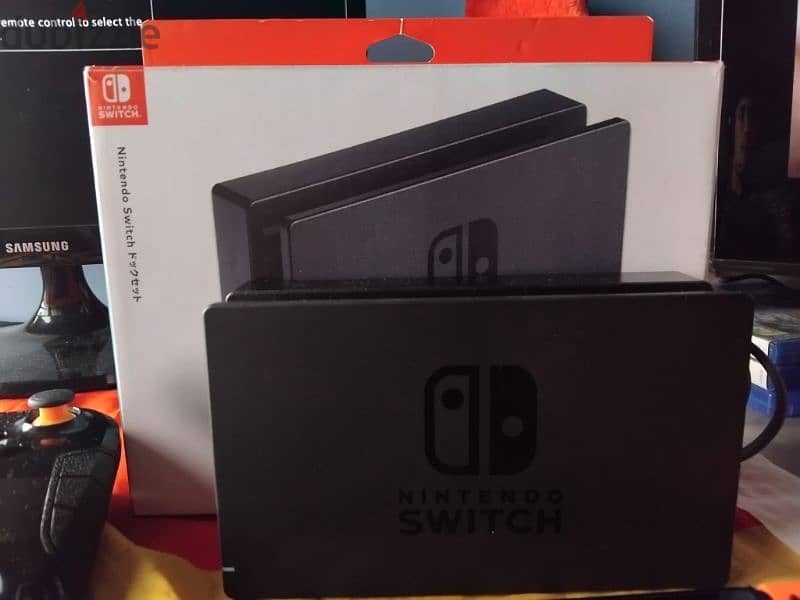 Nintendo switch used+charging grip+extra controller+charger+fc25 180$ 2